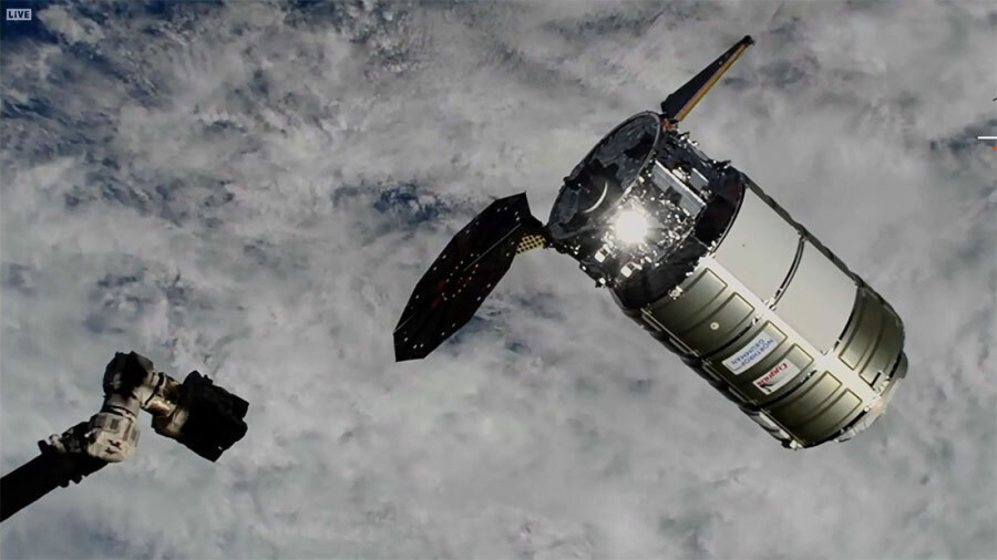 This photo provided by NASA shows a Northrop Grumman cargo ship about to be captured by the International Space Station's robot arm on Wednesday, Nov. 9, 2022. The capsule delivered more than 8,000 pounds of supplies to the International Space Station on Wednesday, despite a jammed solar panel.