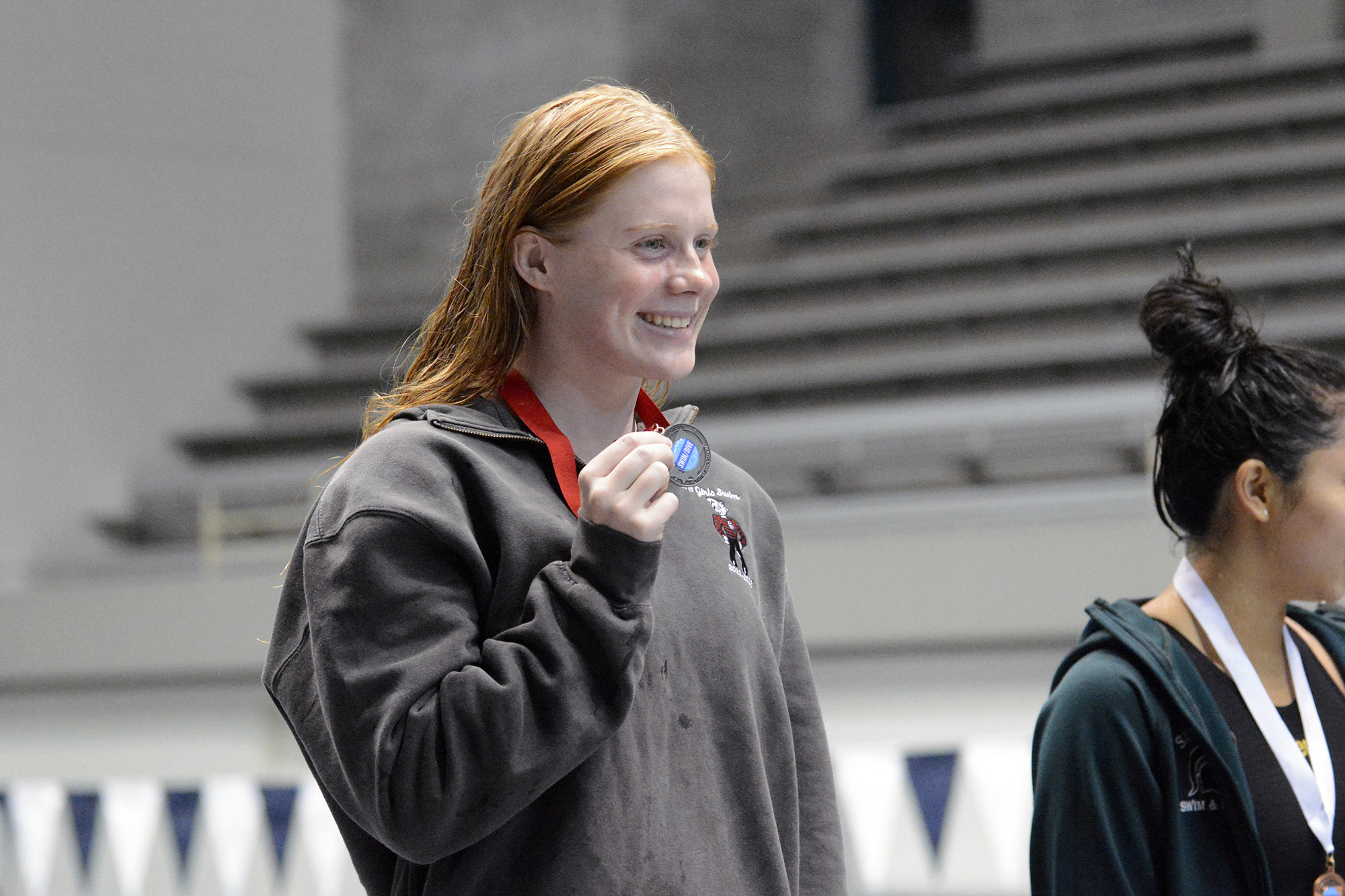 Campbell Deringer of Camas holds her medal after placing second in the 100 breaststroke in the Class 4A meet at the state swim meet at Federal Way on Saturday, Nov. 12, 2022.