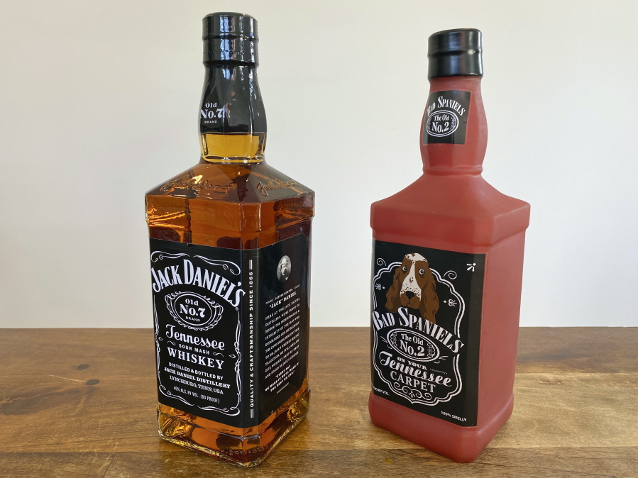 A bottle of Jack Daniel's Tennessee Whiskey is displayed next to a Bad Spaniels dog toy in Arlington, Va., Sunday, Nov. 20, 2022. Jack Daniel's has asked the Supreme Court justices to hear its case against the manufacturer of the toy.