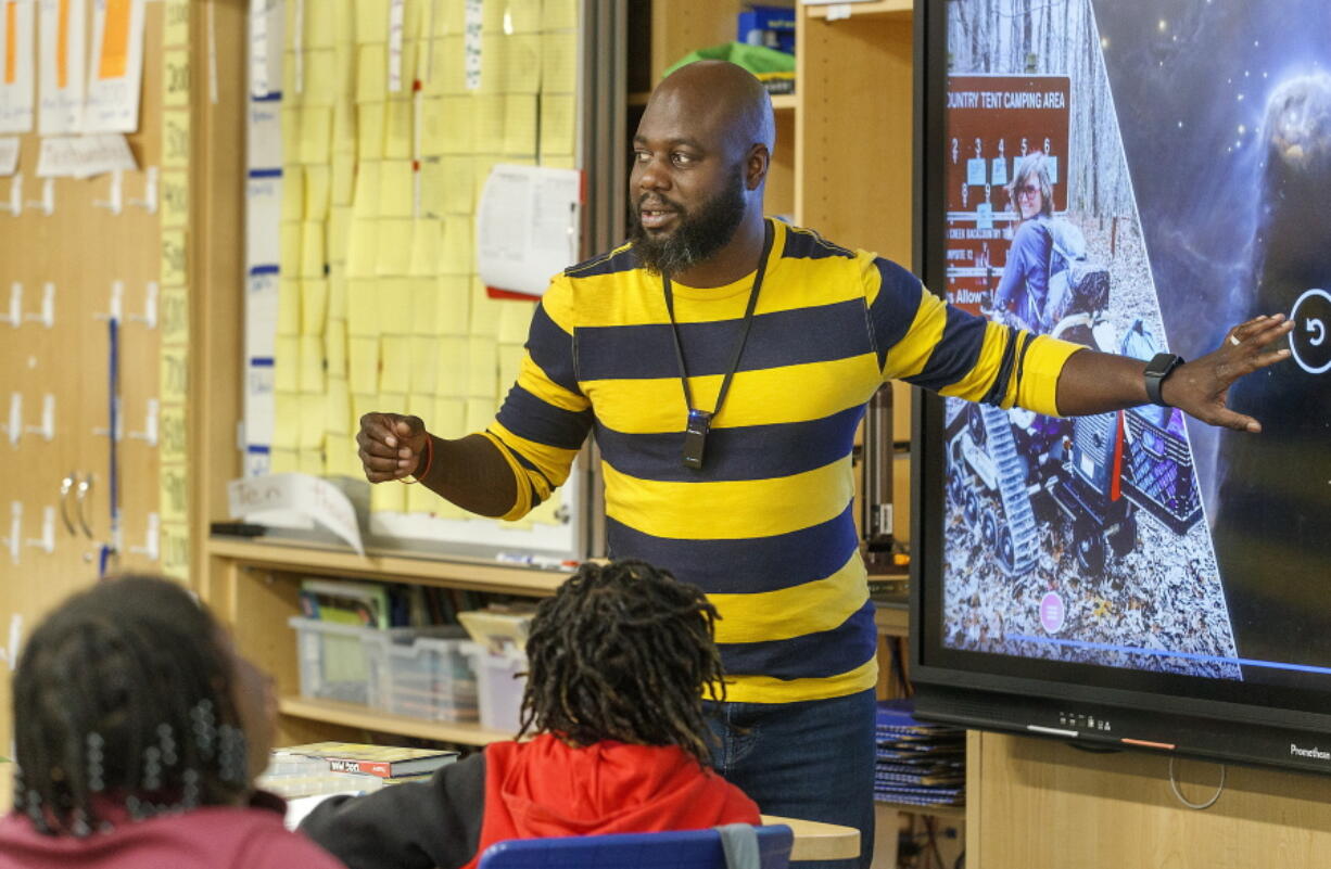 Tyler Wright teaches 4th grade math at Stono Park Elementary School in Charleston, S.C., Friday, Nov. 18, 2022. America's teacher workforce has long been whiter than its student body. In South Carolina, Charleston County aims to increase the number of Black male teachers in the classroom -- 60 more in the next three years. While teacher vacancies are affecting all educators, experts say if South Carolina wants its Black students to succeed, it can't afford to lose any more Black men in the classroom.