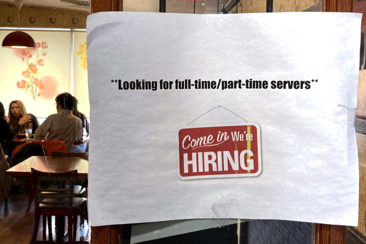 FILE - A hiring sign is displayed at a restaurant in Morton Grove, Ill., Thursday, April 28, 2022.  Labor Department releases weekly report on unemployment benefits on Wednesday, Nov. 23.  (AP Photo/Nam Y.
