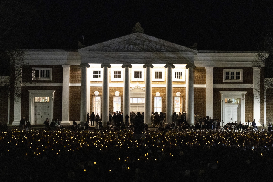 University of Virginia students participate in a vigil in response to shootings that happened on campus the night before in Charlottesville, Va., Monday, Nov. 14, 2022.