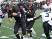 Washougal's Liam Atkin runs with the ball during the Panthers' 38-34 over Shelton in a 2A district playoff in Washougal on Saturday, Nov. 5, 2022.