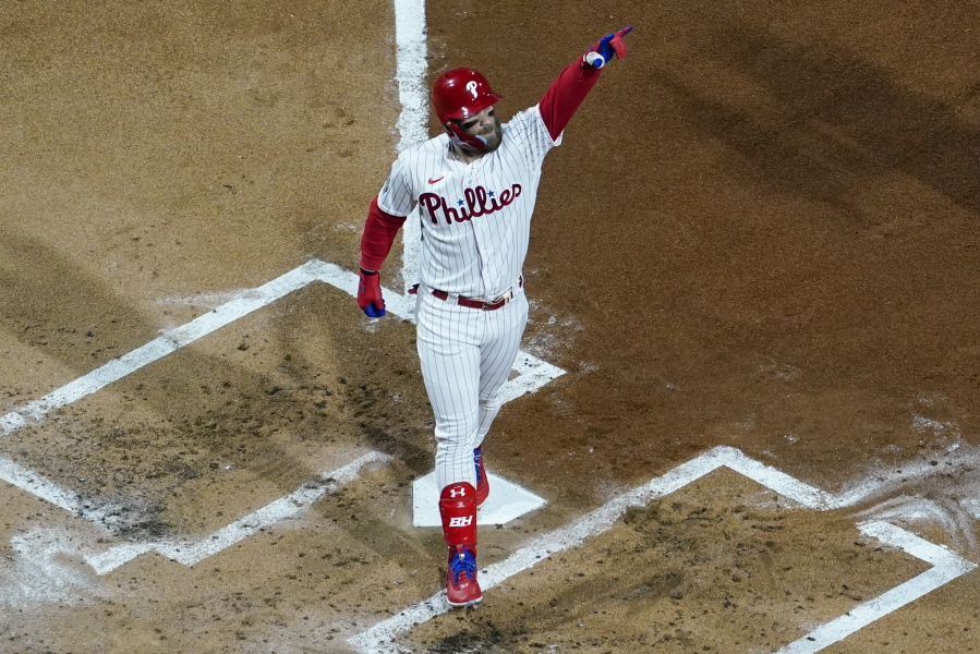 Philadelphia Phillies' Bryce Harper celebrates his two-run home run during the first inning in Game 3 of baseball's World Series between the Houston Astros and the Philadelphia Phillies on Tuesday, Nov. 1, 2022, in Philadelphia.