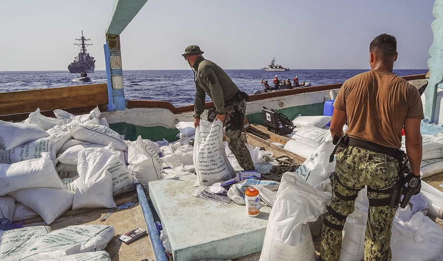 In this photo released by the U.S. Navy, sailors inventory urea and ammonium perchlorate found on a dhow intercepted in the Gulf of Oman on Nov. 9, 2022. The U.S. Navy said Tuesday, Nov. 15, 2022, it found 70 tons of a missile fuel component hidden among bags of fertilizer aboard a ship bound to Yemen from Iran, the first-such seizure in that country's yearslong war as a cease-fire there has broken down. (Sonar Technician 1st Class Kevin Frus/U.S.