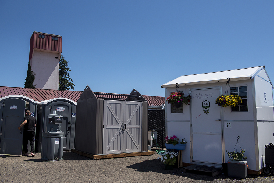 Portable toilets and a hand-washing station are among the facilities available for clients at the Living Hope Safe Stay Community on  July 14, 2022.