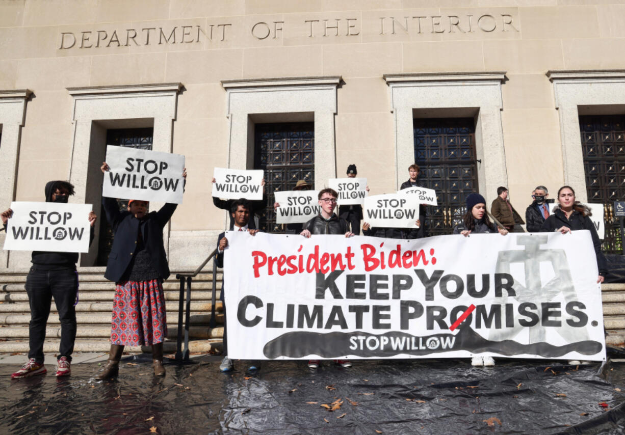 Climate activists hold a demonstration to urge President Joe Biden to reject the Willow Project at the US Department of Interior on Nov. 17, 2022, in Washington, D.C.