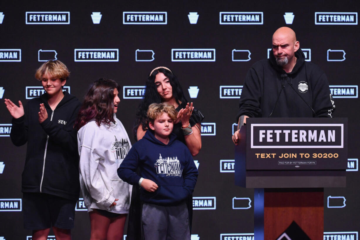 Pennsylvania Democratic Senatorial candidate John Fetterman stands with his family as he speaks on stage at a watch party during the midterm elections at Stage AE in Pittsburgh, Pennsylvania, on Nov. 8, 2022.