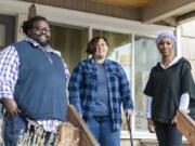 Malaya McGant, right, Ari, middle, and Terrell Berry stand outside The Perch youth drop-in center in Vancouver. Berry previously worked with Janus Youth Programs and now works at A Way Home Washington helping youth facing homelessness. McGant and Ari both became homeless at age 19, and Berry has provided them guidance over the years.