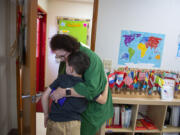 Nikki Skinner, founder of Skinner Montessori School and classroom teacher, shares a kind moment with student Callem Lorenzo, 8, during a break from class. Vancouver's Skinner Montessori School is celebrating its 50th anniversary next year.