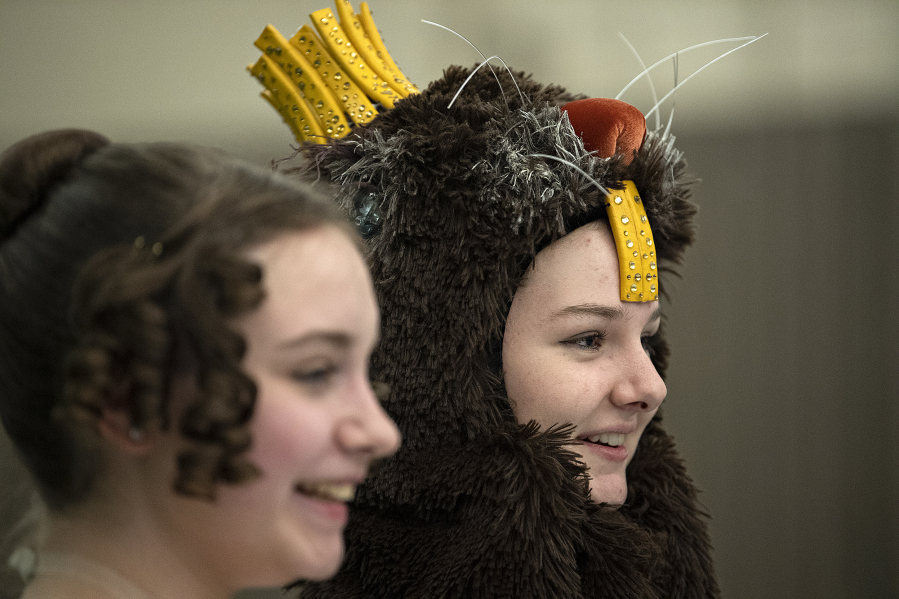 "Nutcracker" dancers Esther Tully (as Cecelia), left, and Sophie Dickman (as Le Castor, the beaver king) share a chuckle during dress rehearsal at Columbia Dance.