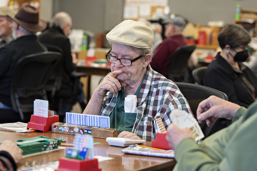 Player John Yadon of Gresham, Ore., keeps his concentration while taking on opponents during a recent 11 a.m. Wednesday weekly game at the Vancouver Bridge Club.