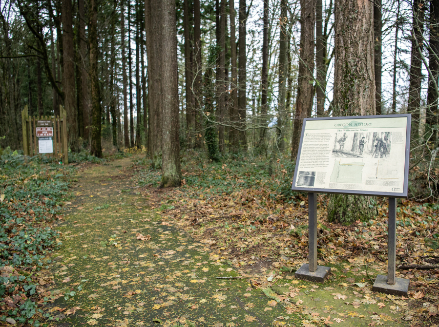 A forested trail leads visitors from Northwest Skyline Boulevard down a short path to the Willamette Stone, the spot from which all property in the Pacific Northwest can be defined. The site is managed by Oregon State Parks.