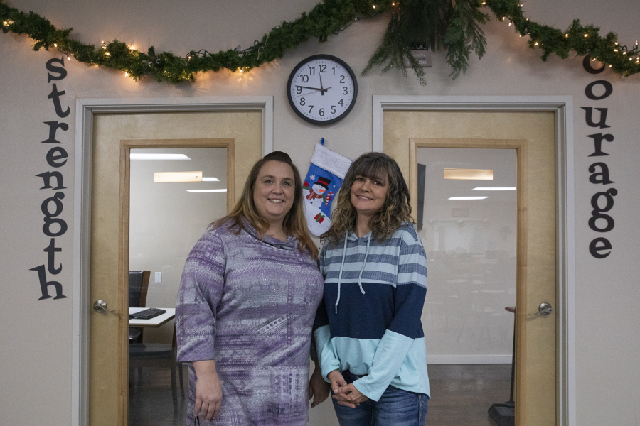 Rachel Grant, left, a family navigator, and Rebecca Greiner, a senior family navigator, pose for a portrait at Recovery Caf? of Clark County.