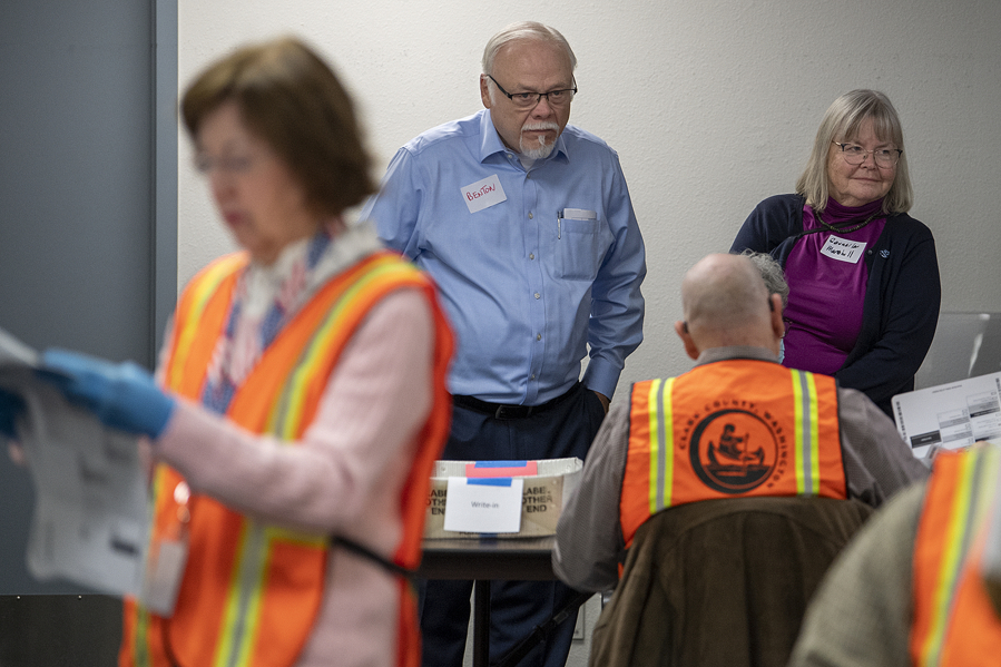 Don Benton joins District 5 County Councilor Sue Marshall at the Clark County Elections Office on Friday to look over results from the manual recount of 12 precincts requested by Benton.