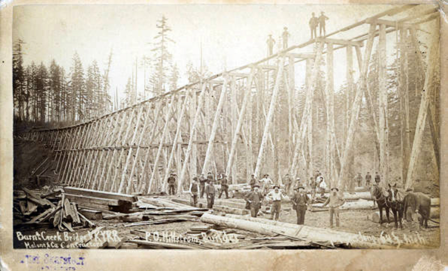 Bridge workers pose for a photo during the construction of Burnt Bridge Creek rail bridge in 1904. The stream's namesake seems to derive from two bridges that burned about 40 years apart. Both were about 2 1/2 miles north of Fort Vancouver. Hudson Bay Company built the first one to move livestock and agricultural goods across the creek, separating pastures and agricultural land from Fort Vancouver.