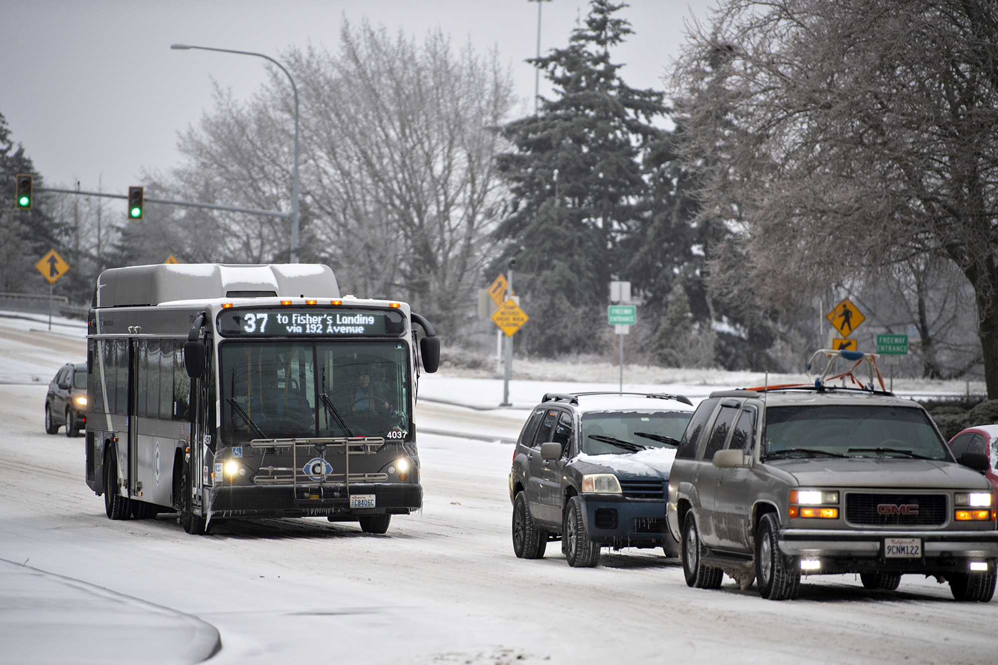 A bus joins traffic along a frozen Southeast Mill Plain Boulevard on Friday morning, Dec. 23, 2022.