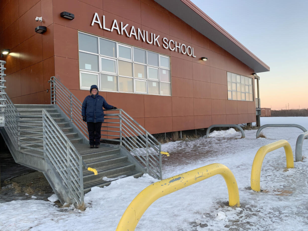 Katie Kressin poses at the Alakanuk School. Since joining as a teacher in 2011, she says, the remote town has grown close to her heart, and she plans to retire there.