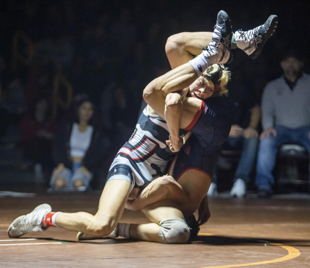 Union’s Jordan Jimenez, left, tries to flip Elliot Mauck of Westview on Friday, Dec. 30, 2022, at the Pacific Coast Wrestling Championships at Hudson’s Bay High School. Jimenez won the 126-pound bout by fall.