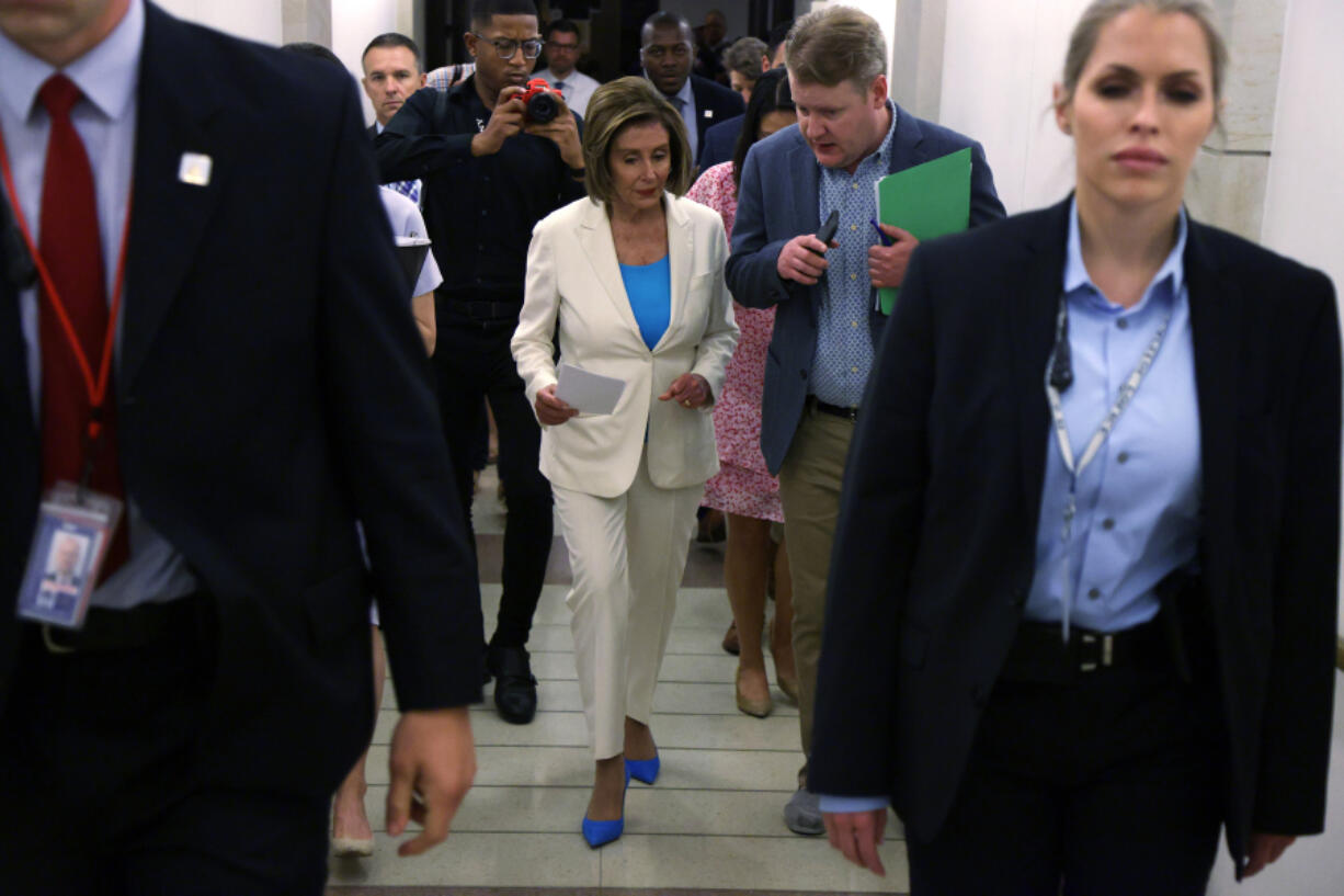 U.S. Speaker of the House Rep. Nancy Pelosi, D-Calif., center, leaves with Deputy Chief of Staff Drew Hammill, second from right, after a weekly news conference at the U.S. Capitol July 1, 2021, in Washington, D.C.