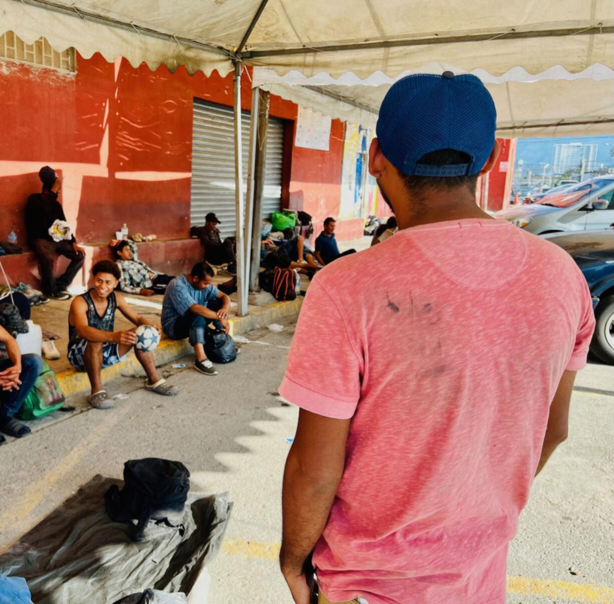 Francisco Contreras, a migrant from Guatemala, stands outside Casa Indi, a sprawling migrant shelter in the industrial city of Monterrey, Mexico. He works day jobs as he raises money to cross into Texas, he hopes.