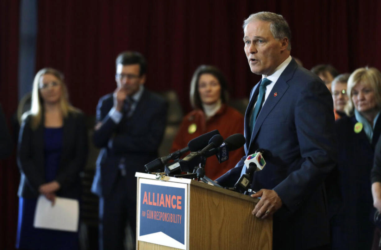 Washington Gov. Jay Inslee speaks Thursday, Feb. 14, 2019, in Seattle at an event held by the Alliance for Gun Responsibility to mark the one-year anniversary of the shooting at Marjory Stoneman Douglas High School in Parkland, Florida, and to talk about efforts in Washington state to reduce gun violence. (AP Photo/Ted S.