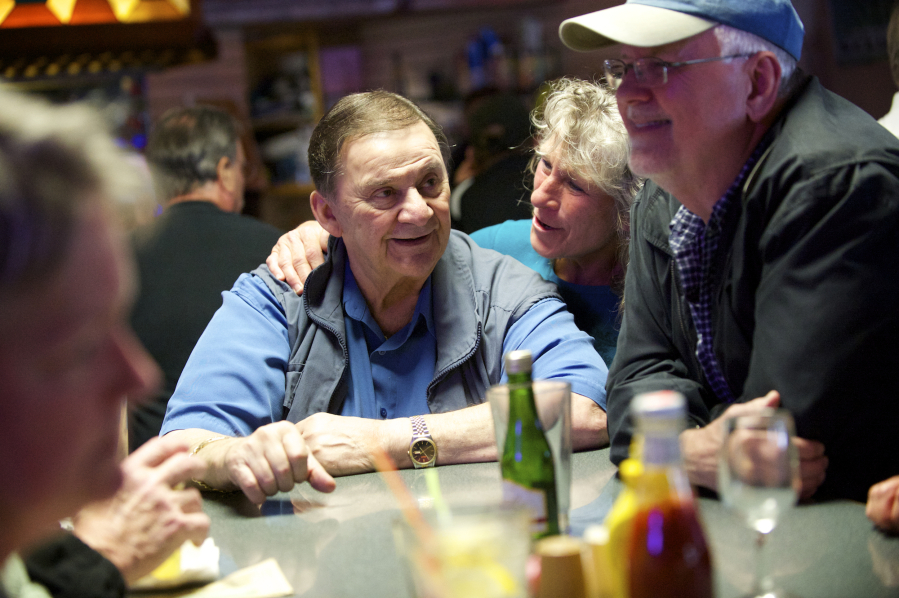 Customer Gayla Golden-Bean gives Chuck Chronis a hug on the final night of business for Chronis' Restaurant and Lounge in April 2015. Chronis died Dec. 4 at 83 years of age.
