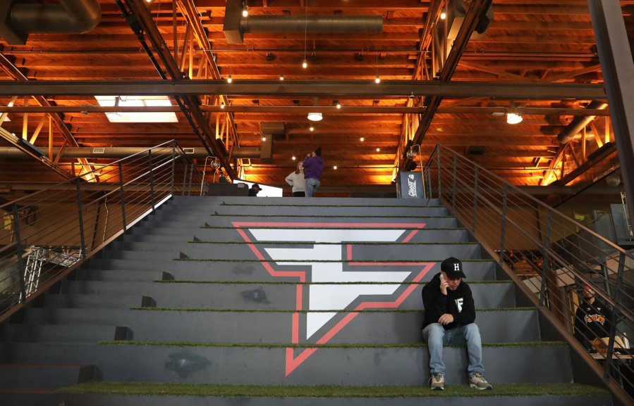 FaZe Clan employee Mike Swiv takes a call at Faze Clan's headquarters in Los Angeles on Nov. 16, 2022.