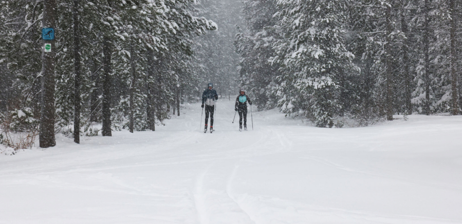 From left, Casey and Leigh Curran cross-country ski at Meissner Sno-park west of Bend, Ore.