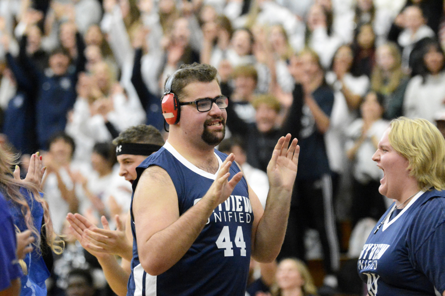 Skyview Unified athlete Lucas Anderson celebrates making a basket during a demonstration game to celebrate Skyview High School's designation as a Special Olympics Unified Champion School.