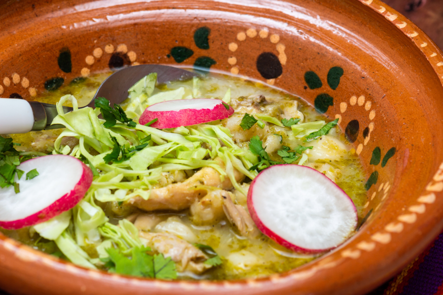 This Chicken Pozole Verde derives its flavor from poultry that's been simmered in a tangy sauce made from tomatillos, cilantro and green chilies.