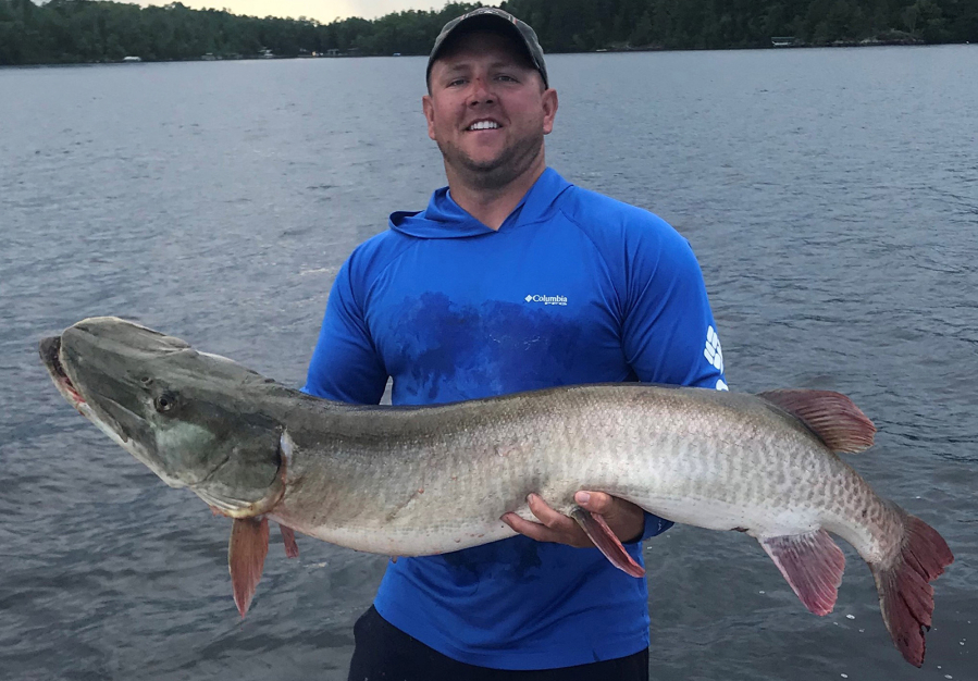 Corey Kitzmann of Davenport, Iowa, owns the new Minnesota muskie release record. He caught this 57 1/4 inch fish while on Lake Vermilion on Aug. 6, 2019.