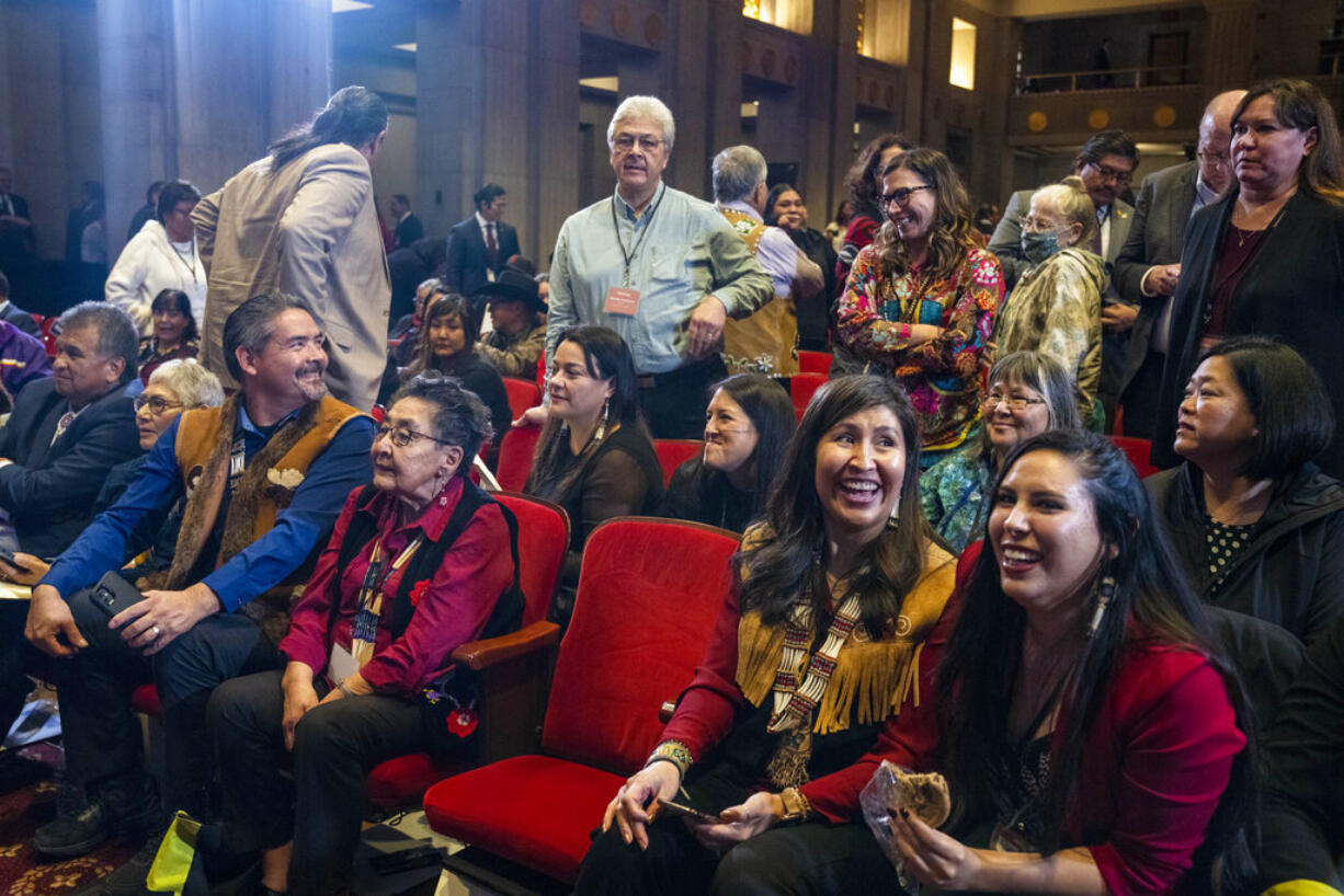 Attendees of the Tribal Summit await the arrival of Vice President Kamala Harris, Wednesday, Nov. 30, 2022, at the Department of the Interior in Washington.