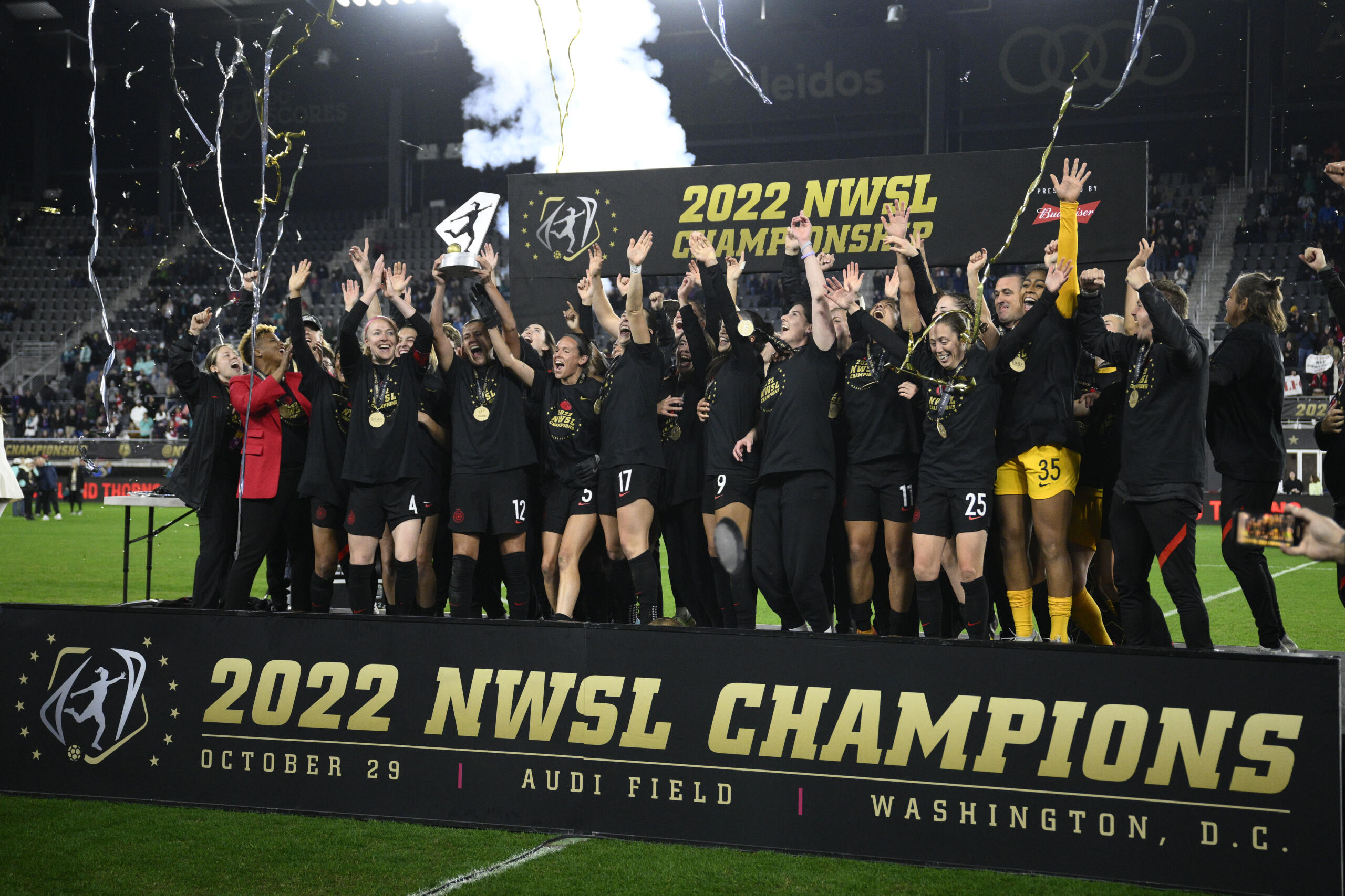Portland Thorns celebrate with the trophy after winning the NWSL championship against the Kansas City Current on Oct. 29, 2022, in Washington. The owner of the Portland Thorns announced Thursday, Dec. 1, he is putting the club up for sale.