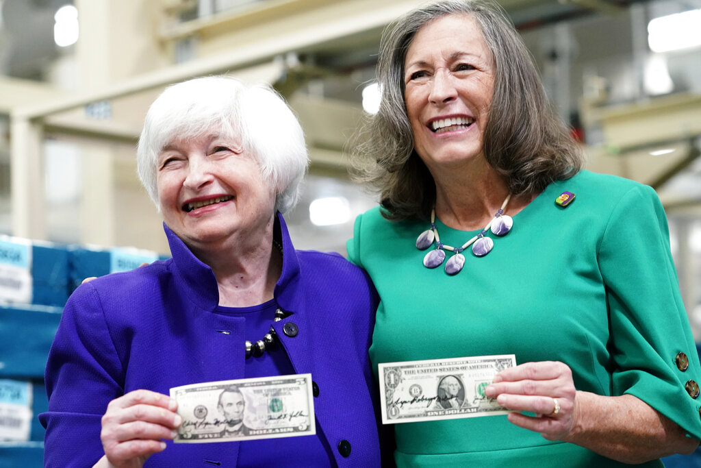 Secretary of the Treasury Janet Yellen, left, and Treasurer of the United States Chief Lynn Malerba show of money they autographed during a tour of the Bureau of Engraving and Printing's (BEP) Western Currency Facility in Fort Worth, Texas, Thursday, Dec. 8, 2022. Yellen unveiled the first U.S. currency bearing her signature, marking the first time that U.S. bank notes will bear the name of a female treasury secretary.