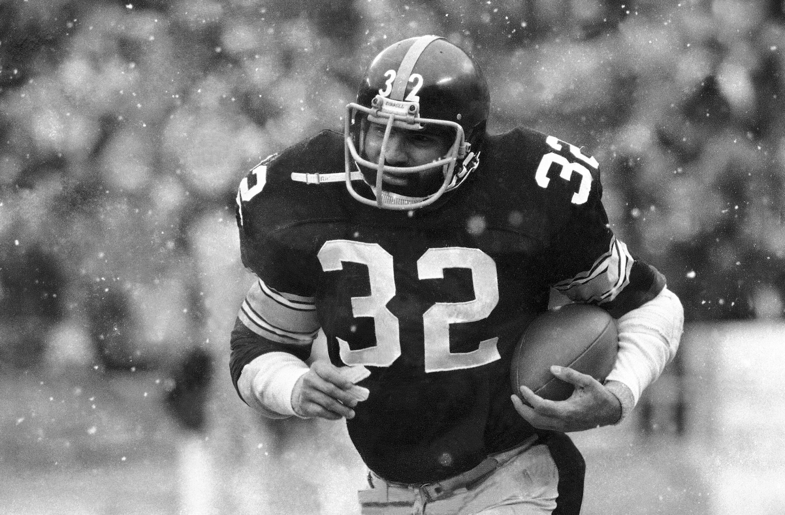 FILE - Franco Harris of the Pittsburgh Steelers runs against the Seattle Seahawks in first period action Sunday, Sept. 10, 1978, in Pittsburgh. Franco Harris, the Hall of Fame running back whose heads-up thinking authored “The Immaculate Reception,” considered the most iconic play in NFL history, died Wednesday, Dec. 21, 2022. He was 72.