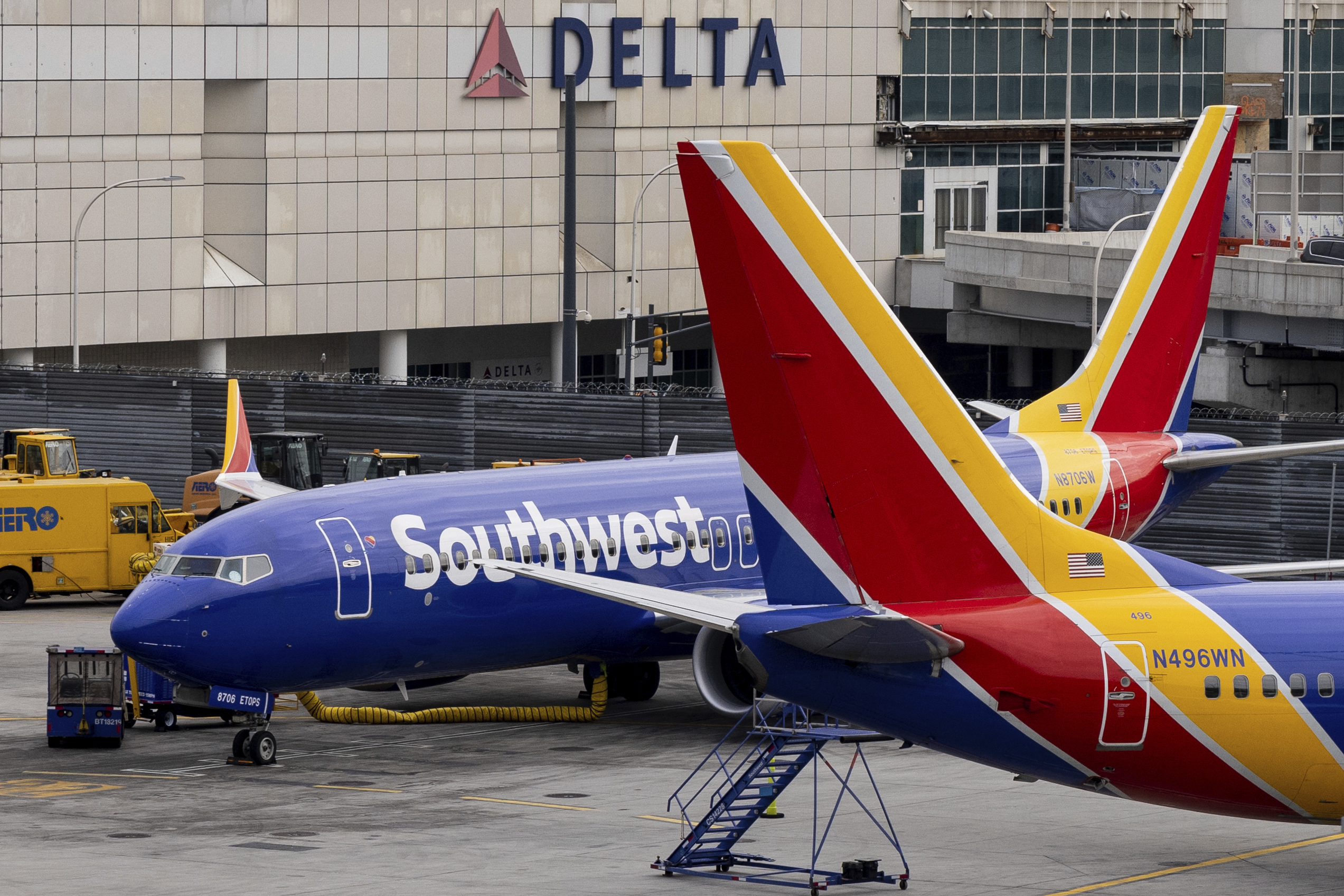 Southwest Airlines' aircrafts parked on the tarmac of LaGuardia Airport, Tuesday, Dec. 27, 2022, in New York. The U.S. Department of Transportation says it will look into flight cancellations by Southwest Airlines that have left travelers stranded at airports across the country amid an intense winter storm.