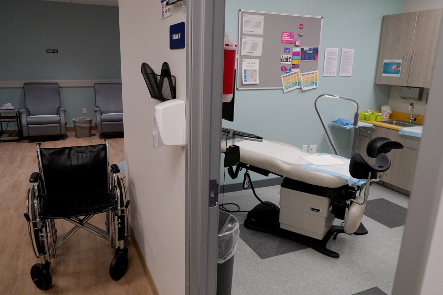 FILE - An unoccupied recovery area, left, and an abortion procedure room are seen at a Planned Parenthood Arizona facility in Tempe, Ariz., on June 30, 2022. On Friday, Dec. 30, 2022, the Arizona Court of Appeals concluded that abortion doctors can't be prosecuted under a pre-statehood law that criminalizes nearly all abortions. The law had been blocked from being enforced shortly after the U.S. Supreme Court issued its 1973 Roe v. Wade decision. But after the Supreme Court overturned the landmark decision in June, Attorney General Mark Brnovich asked a state judge to allow the law to be implemented.