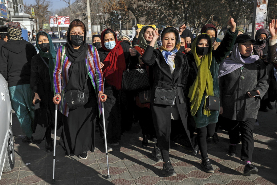 Afghan women chant slogans during a protest against the ban on university education for women, in Kabul, Afghanistan, Thursday, Dec. 22, 2022.