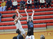 Battle Ground's Tait Spencer shoots the ball over Liberty's Lucas Whitbey (30) during the Tigers' 88-68 win at the Fort Vancouver Holiday Classic on Wednesday, Dec. 28, 2022.