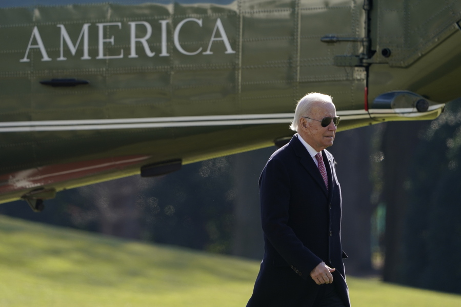 President Joe Biden walks on the South Lawn of the White House after stepping off Marine One, Monday, Dec. 19, 2022, in Washington. Biden is returning to Washington after spending the weekend at his home in Delaware.