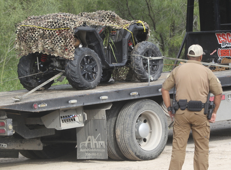 An ATV vehicle is removed from the scene where an off duty border patrol agent was killed on Wednesday Dec. 7, 2022 in Mission, Texas.