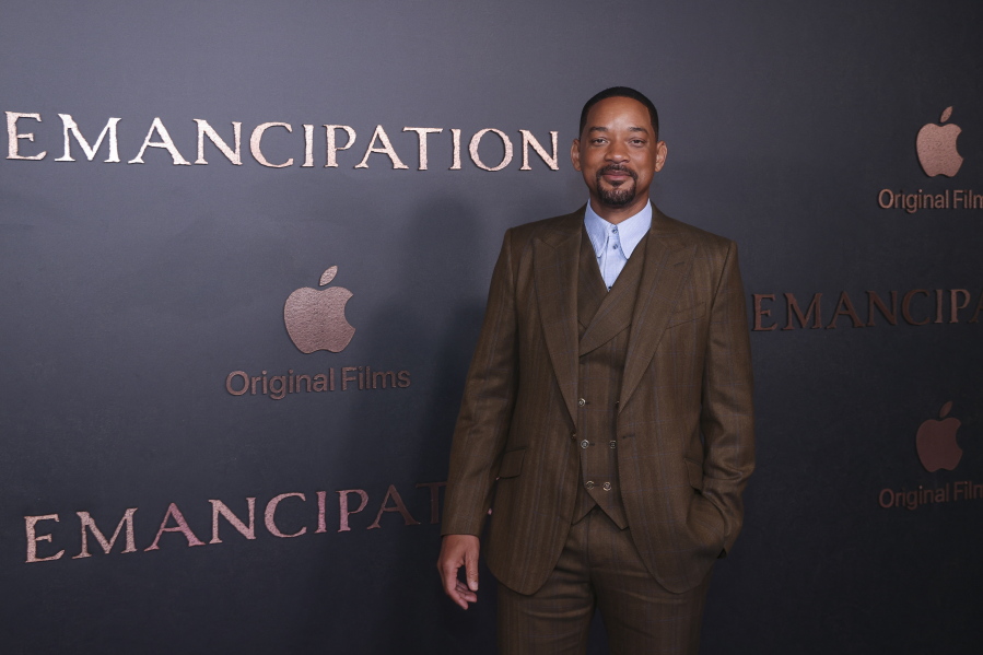 Will Smith poses for photographers upon arrival for the premiere of the film 'Emancipation' in London, Friday, Dec. 2, 2022.