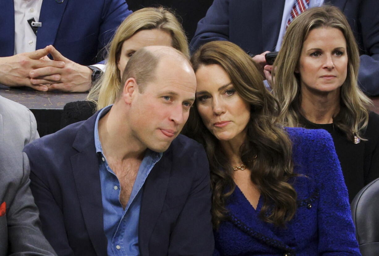 Britain's Prince William and Kate, Princess of Wales, watch the NBA basketball game between the Boston Celtics and the Miami Heat on Wednesday, Nov. 30, 2022, in Boston.