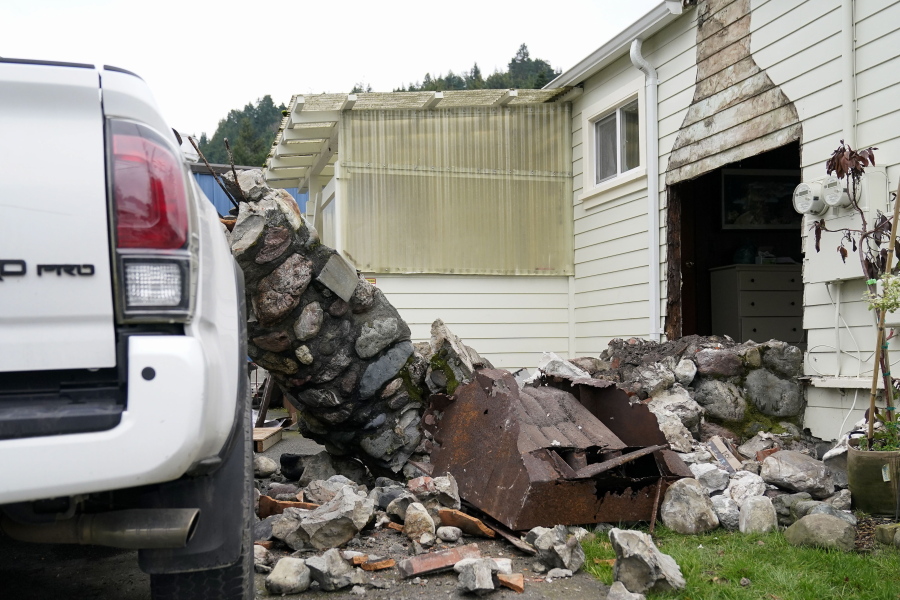 A home damaged by an earthquake can be seen in Rio Dell, Calif., Tuesday, Dec. 20, 2022. A strong earthquake shook a rural stretch of Northern California early Tuesday, jolting residents awake, cutting off power to thousands of people, and damaging some buildings and a roadway, officials said. (AP Photo/Godofredo A.