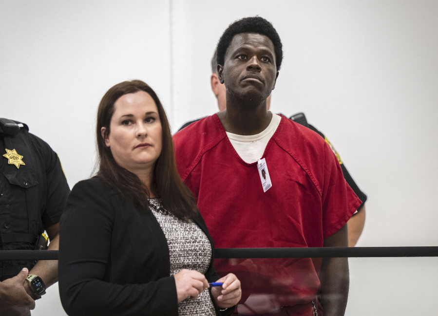 FILE - Wesley Brownlee stands with public defender Allison Nobert during his arraignment in San Joaquin County Superior Court on Tuesday, Oct. 18, 2022. Brownlee has been charged in four additional slayings this week, bringing his total to seven deaths in Northern California since April 2021, authorities said.