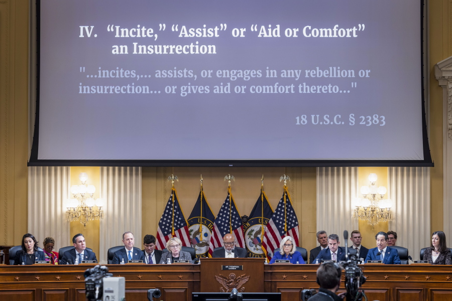 An image with information about the criminal referral of former President Donald Trump to the Department of Justice is displayed as the House select committee investigating the Jan. 6 attack on the U.S. Capitol holds its final meeting on Capitol Hill in Washington, Monday, Dec. 19, 2022.