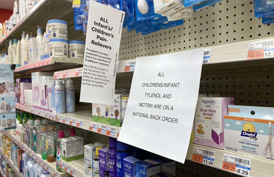 A sign is placed near the section for children's medicine, Sunday, Dec. 18, 2022 at a CVS in Greenlawn, N.Y. Caring for a sick child has become even more stressful than usual for many U.S. parents in recent weeks due to shortages of Children's Tylenol and other medicines.