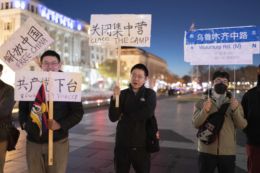 People protest at Freedom Plaza in Washington, Sunday, Dec. 4, 2022, in solidarity with the ongoing protests against the Chinese government's continued zero-COVID policies.