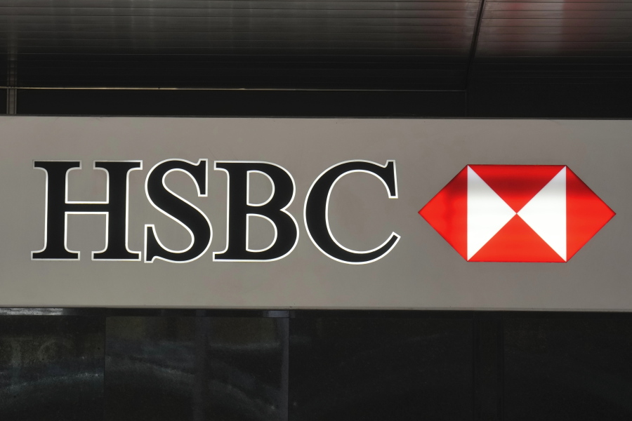 FILE - The logo of the HSBC is seen on a building in Hong Kong, Nov. 16, 2021. Banking giant HSBC announced Wednesday, Dec. 14, 2022, it will no longer finance new oil and gas fields as part of its updated climate strategy.